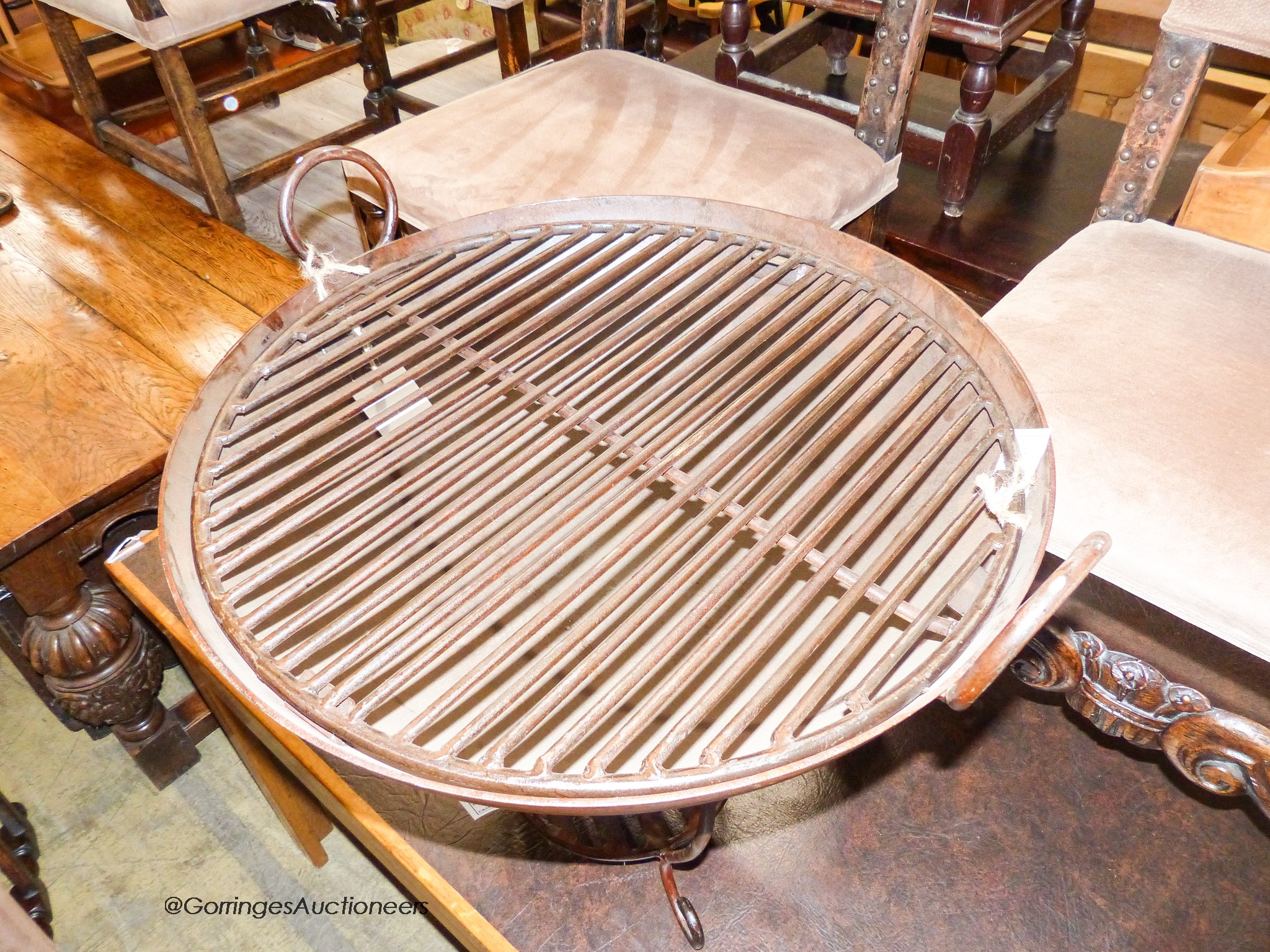 A cast iron fire pit with grill, diameter 67cm, height 65cm